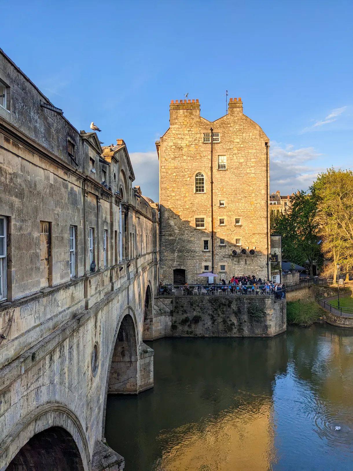 view of Pulteney Bridge in Bath with blue sky