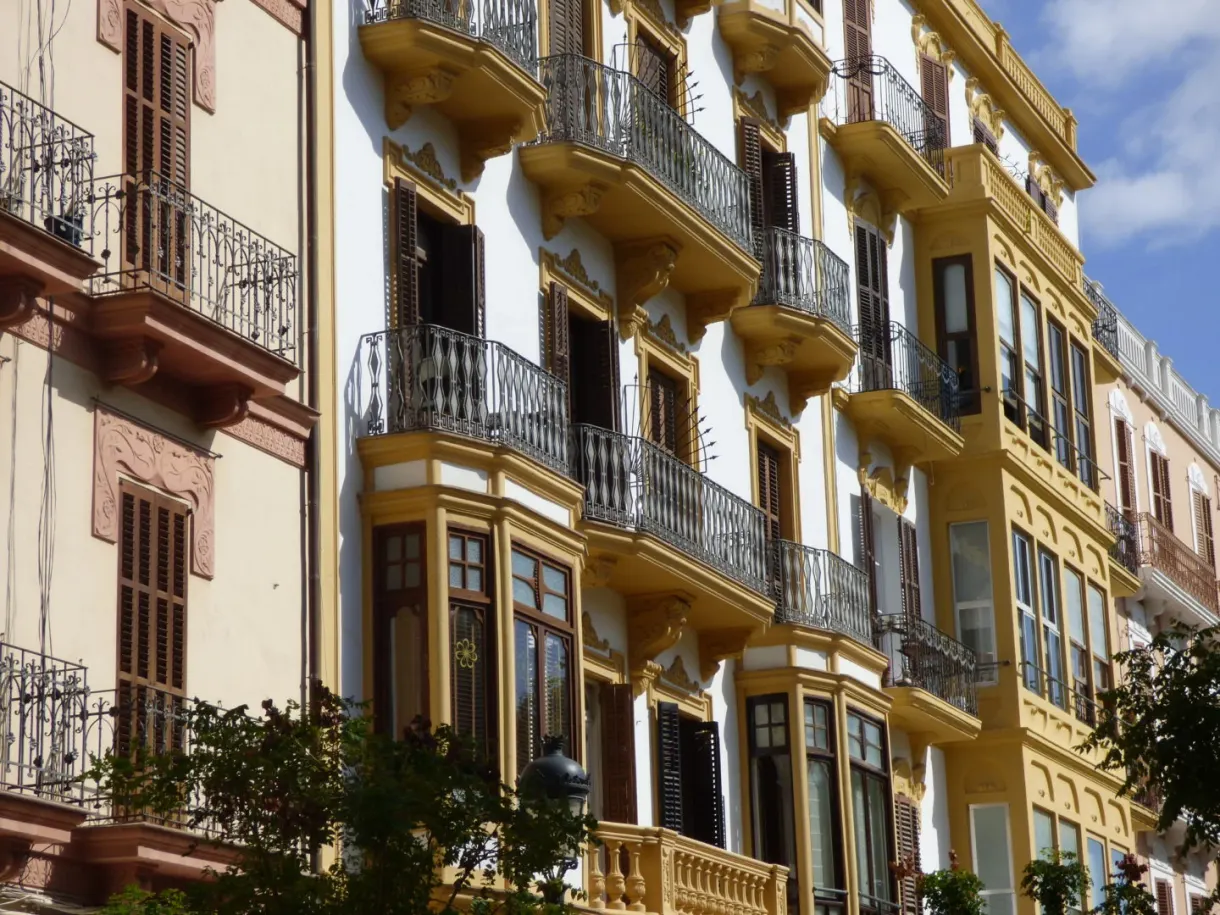 Row of balconies and yellow facades in the town centre