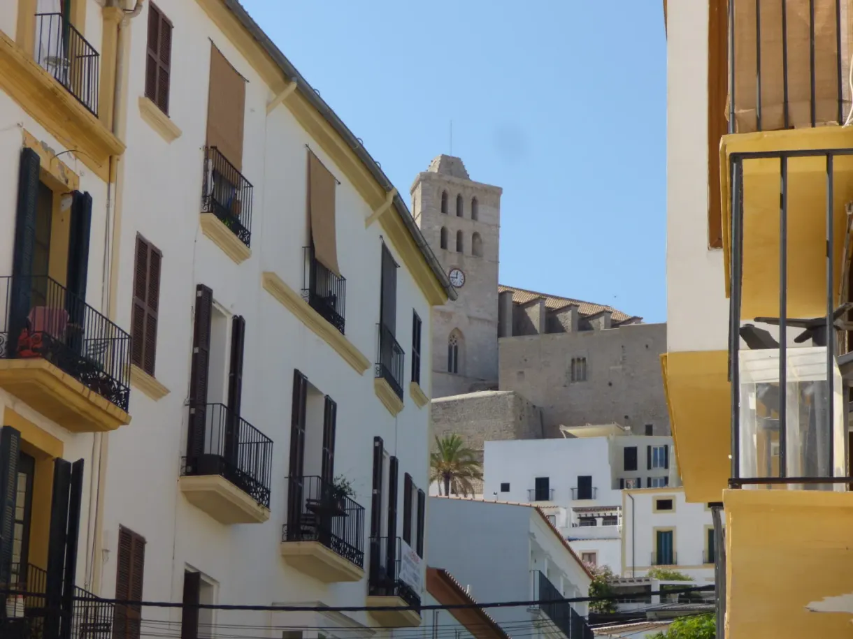 Narrow lane opening onto the bell tower of the cathedral