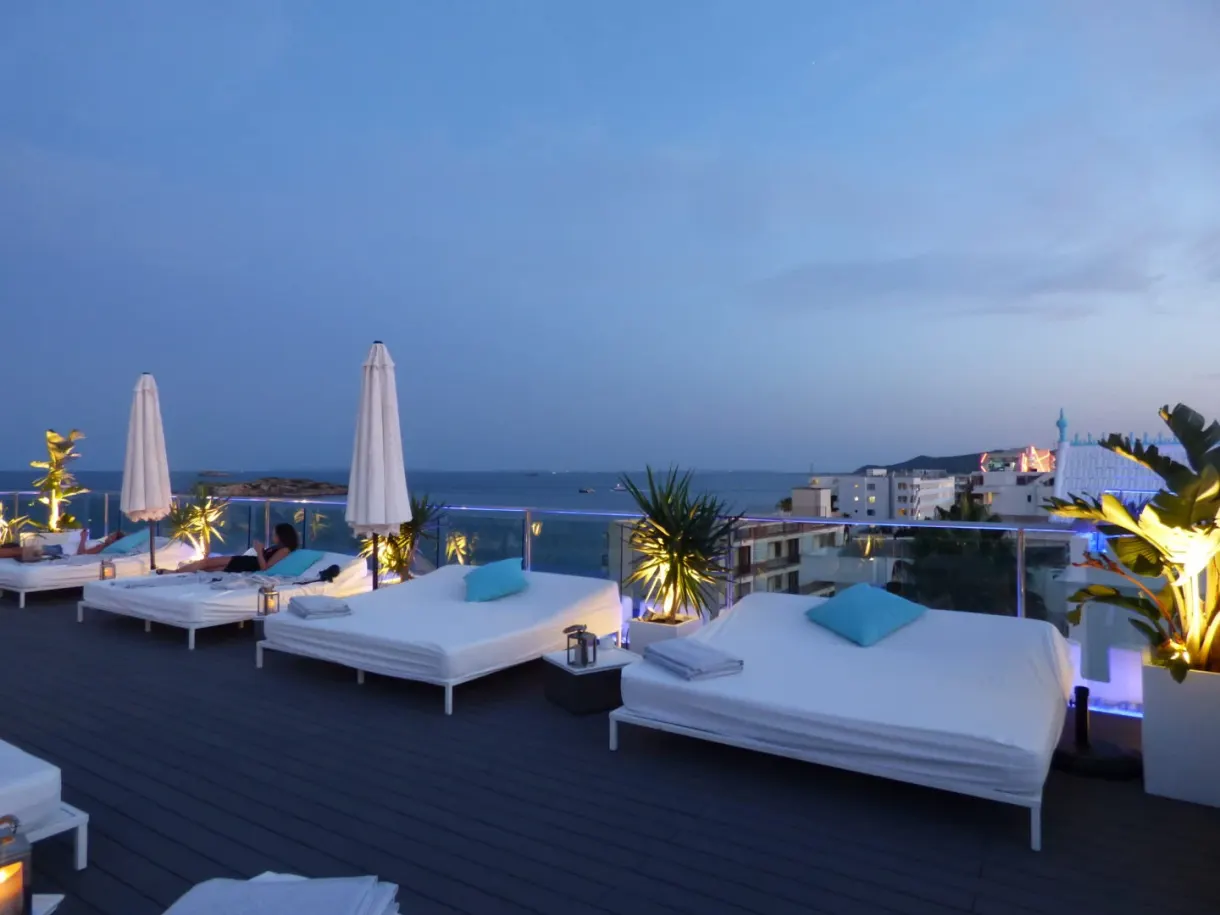 White day beds of a rooftop at dusk