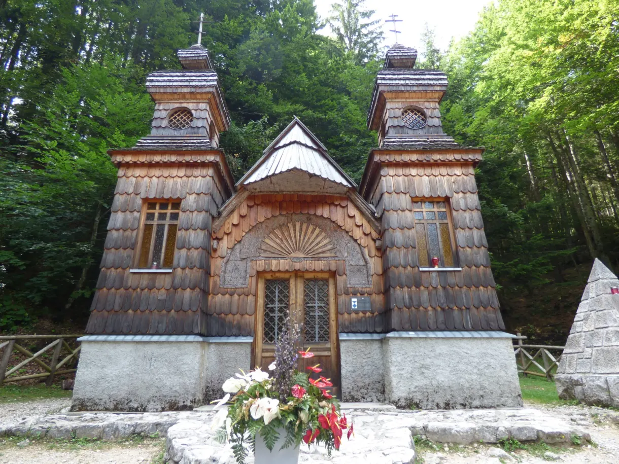 Bunch of flowers laid in front of the wooden chapel