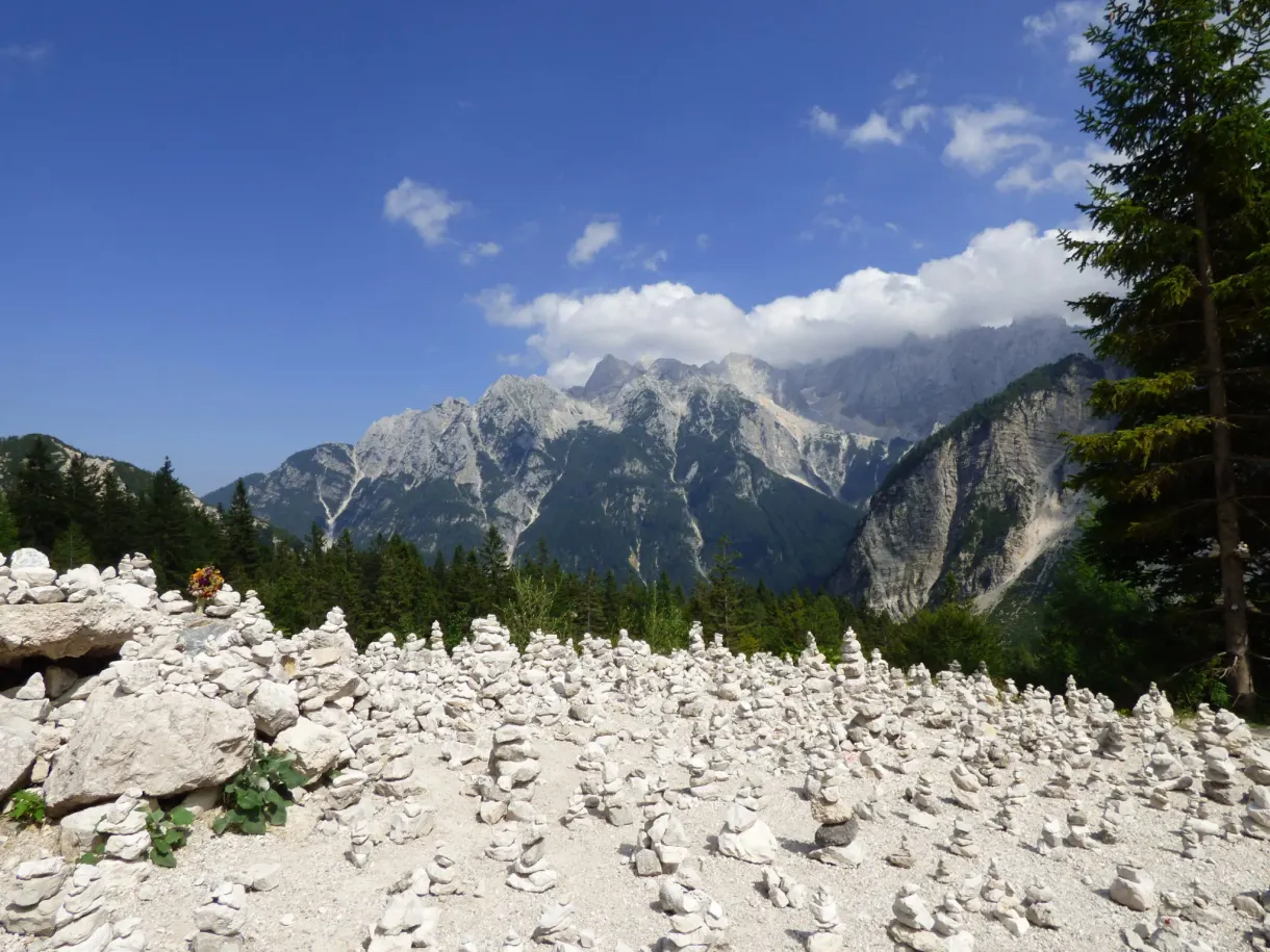 Field of stacked cairns in front of the mountains