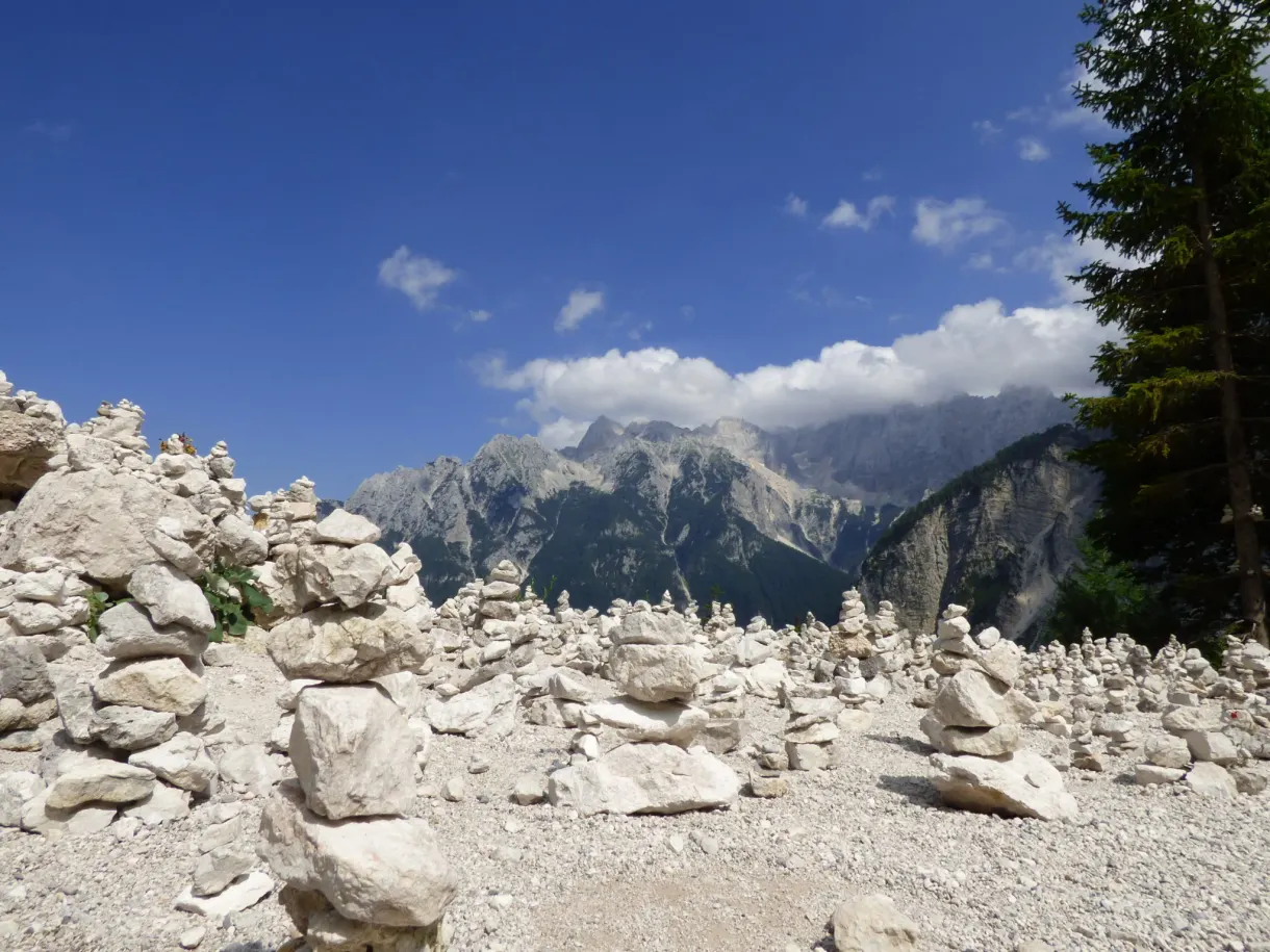 Stacked stones as far as the eye can see at the top of the pass