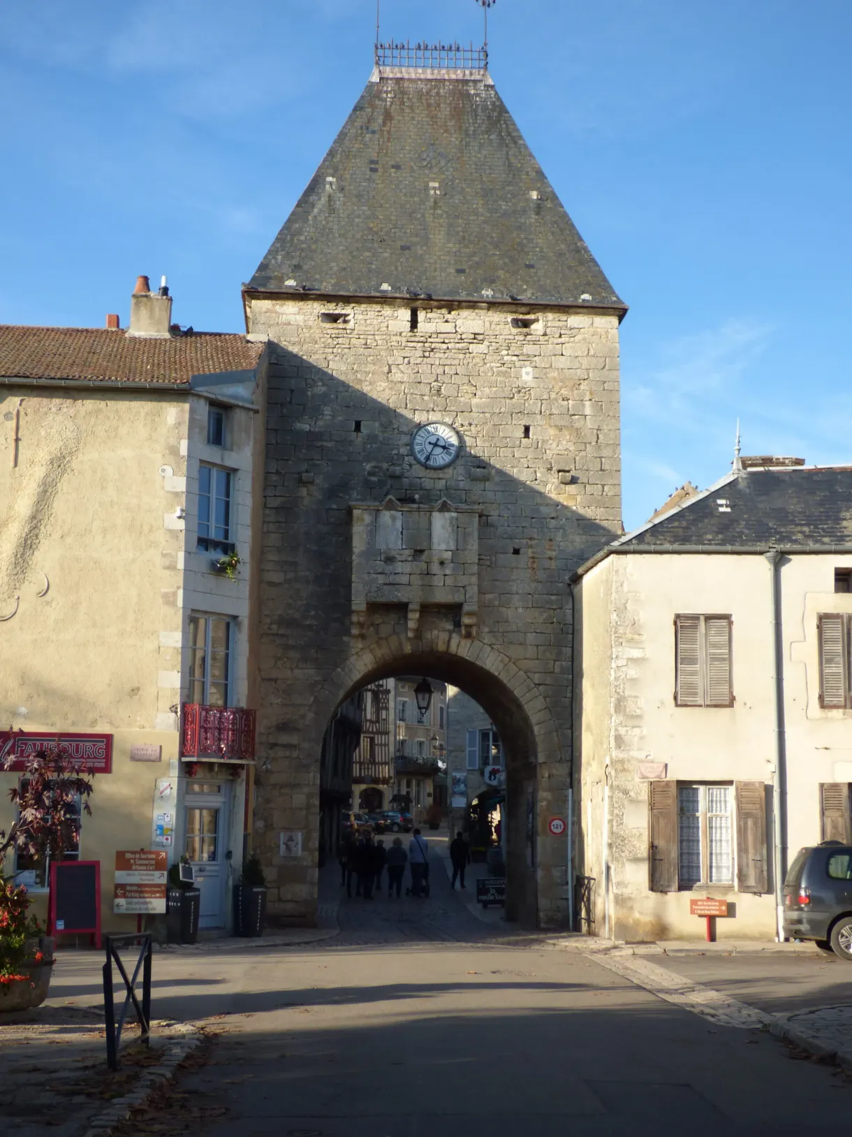 Fortified gate and clock tower at the entrance to the village