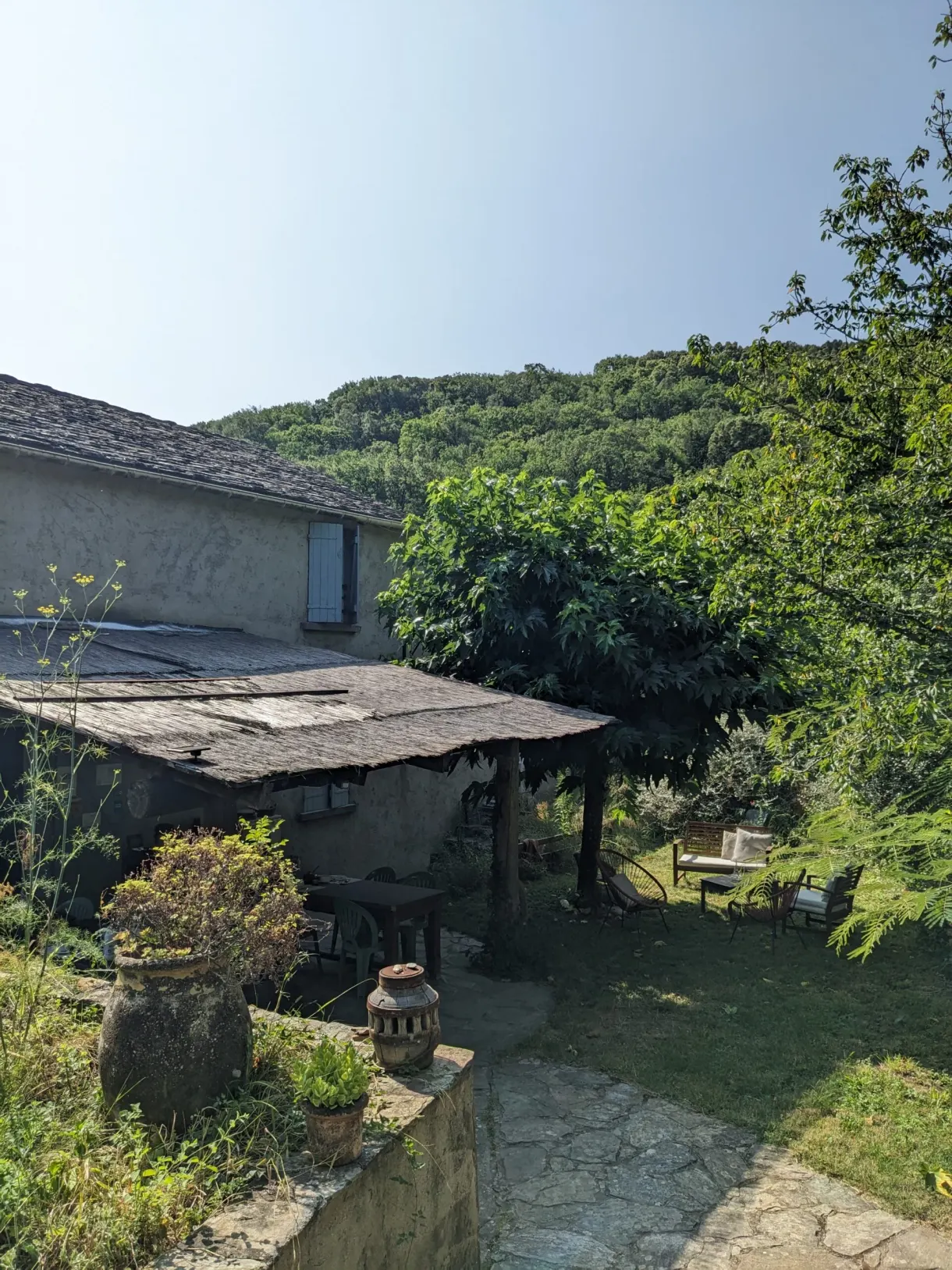 Stone house and its terraced garden amid the greenery
