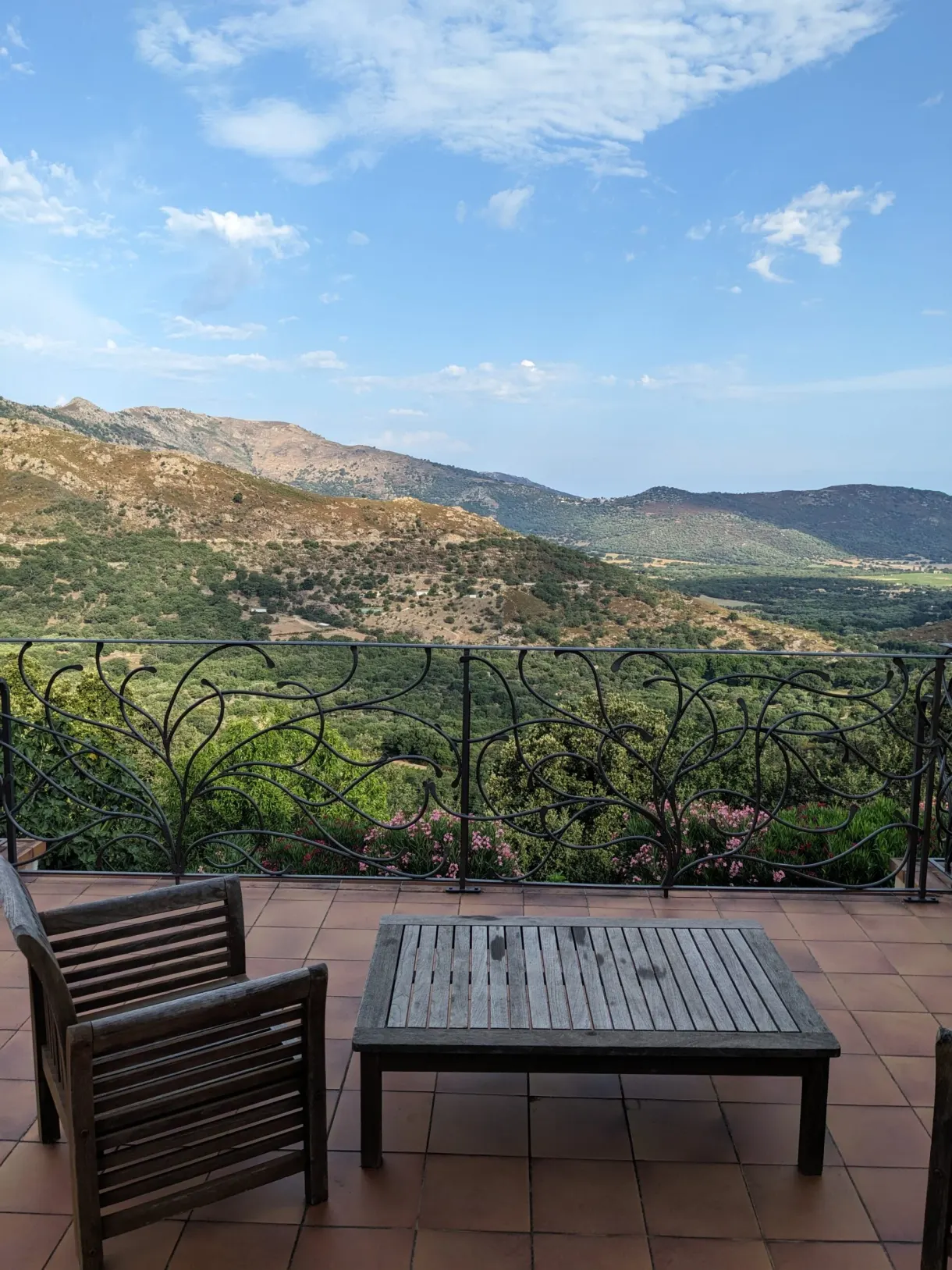 Tiled terrace opening onto the green valley