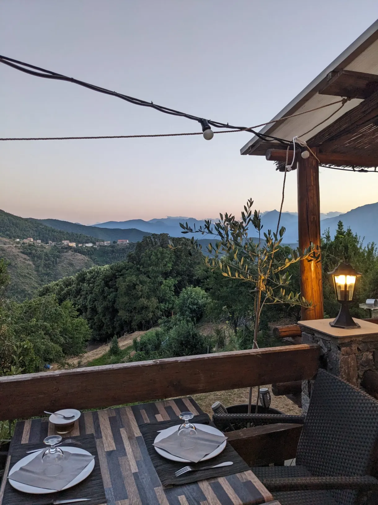Table laid on a restaurant terrace at dusk