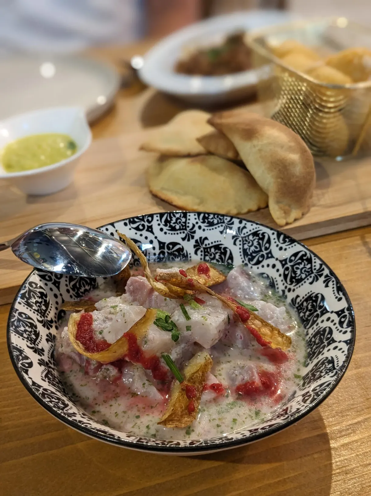 Thinly sliced marinated fish and golden fritters