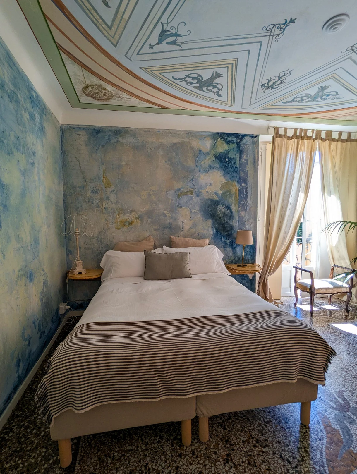 charming blue room in a palazzo in genoa, italy