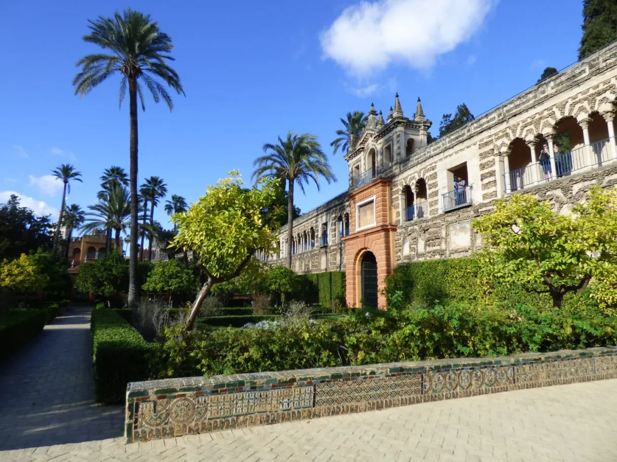 Path lined with azulejo benches running along the facade of the palace