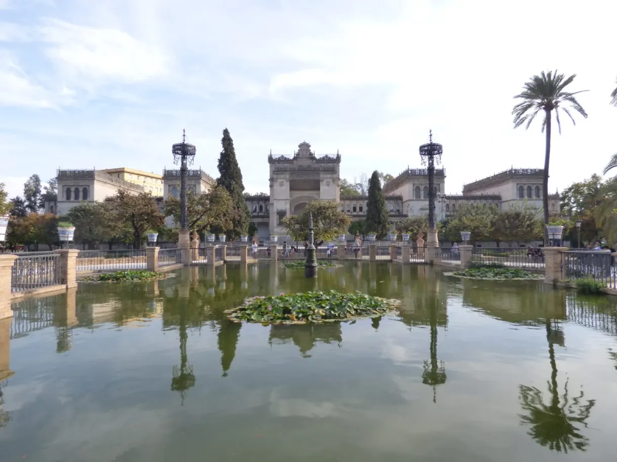 Mudéjar pavilion reflected in a pond covered with water lilies