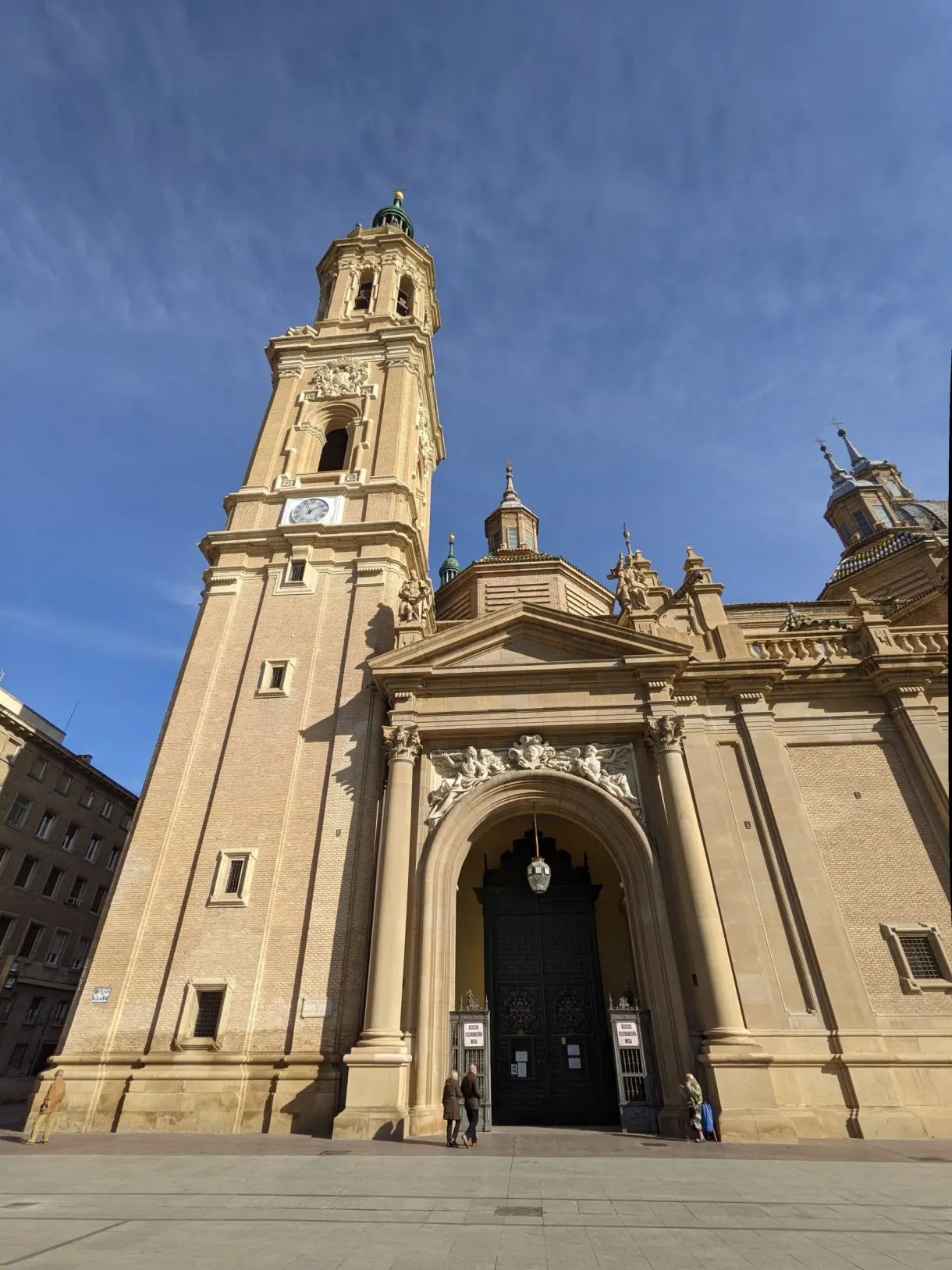 Main portal of the basilica beneath its stone towers