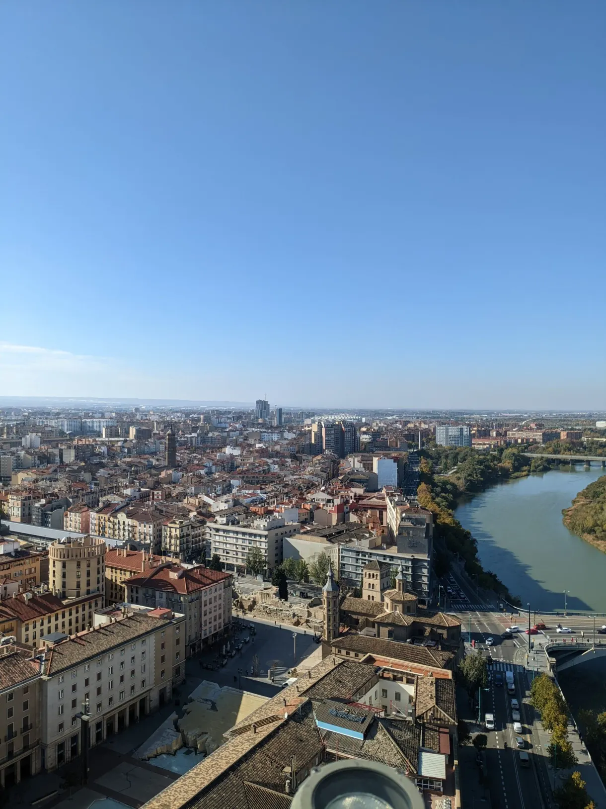 Panorama of the city rooftops and the river from the tower