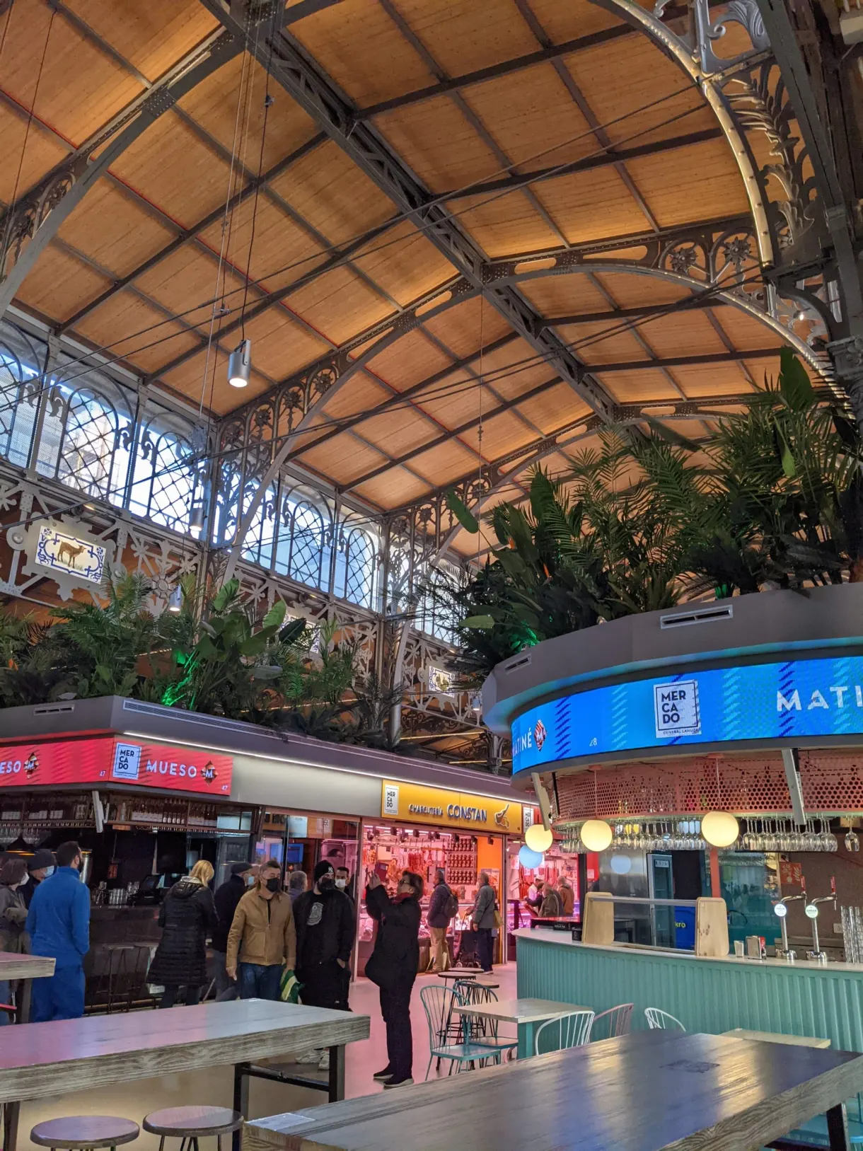 Metal hall of the covered market and its colourful stalls