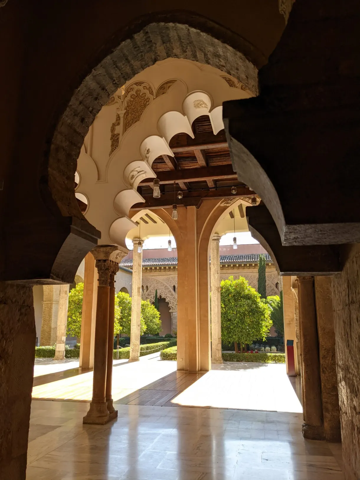 Columned portico opening onto the sunlit patio