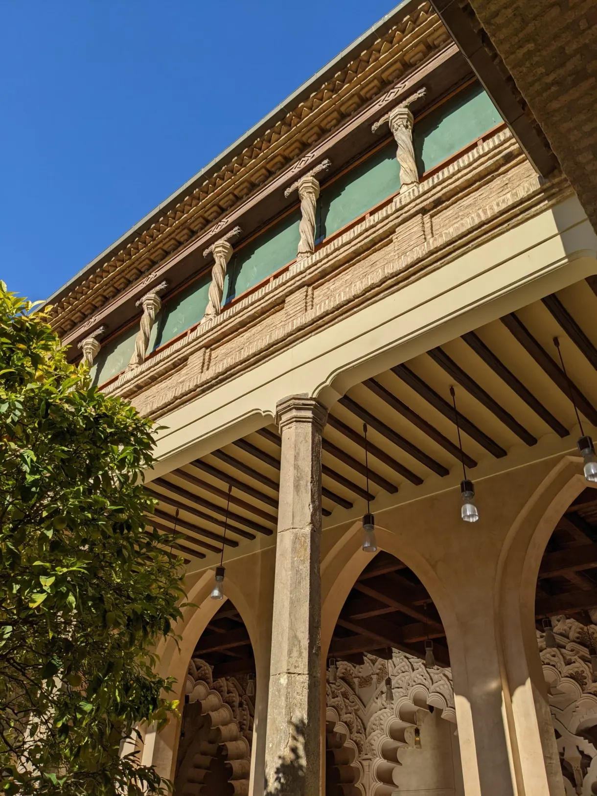 Carved wooden gallery overlooking the arcades of the patio