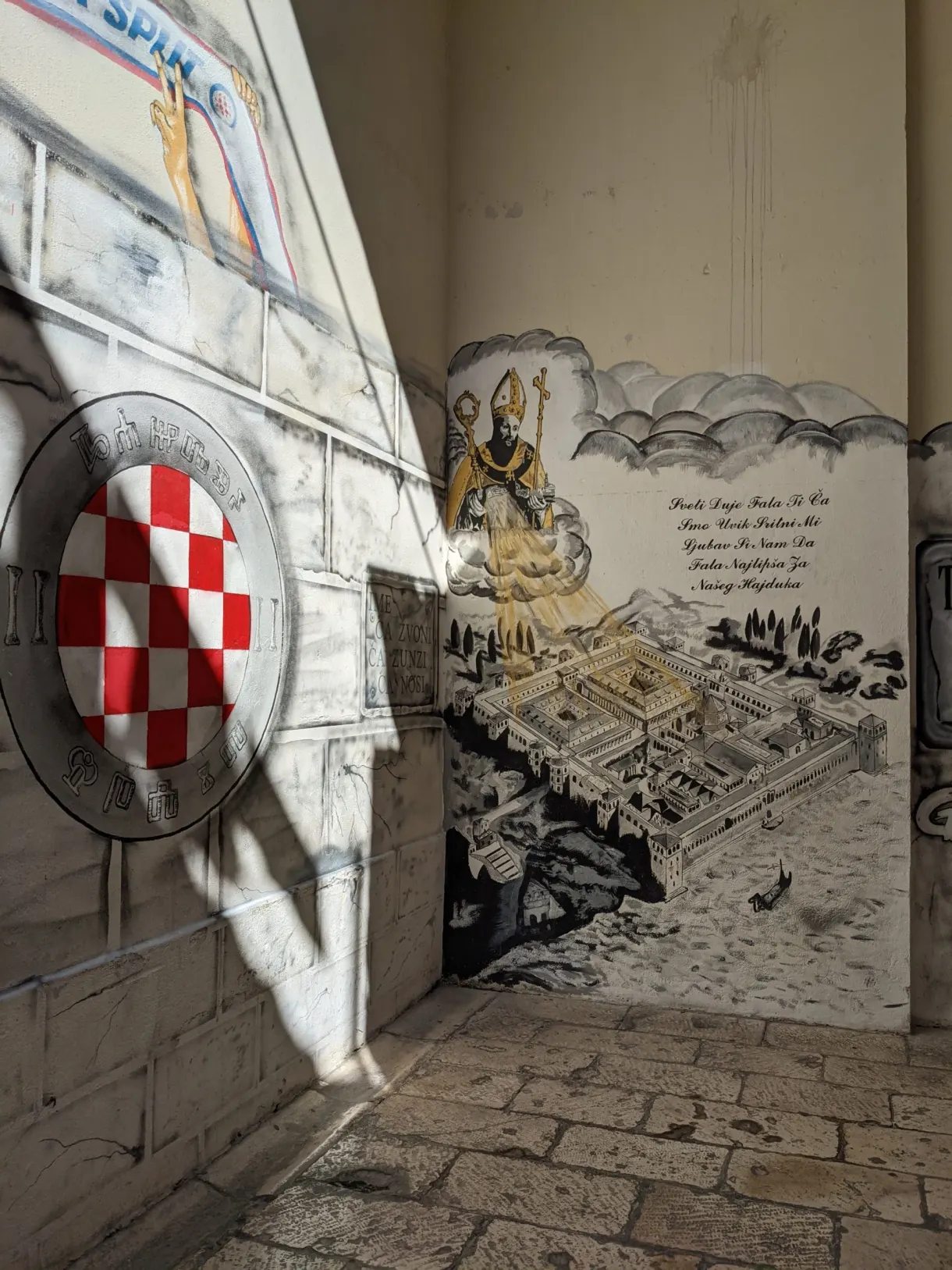 Croatian red and white chequered coat of arms carved on a wall