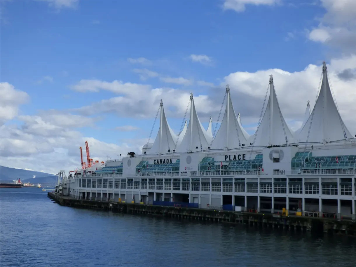 White sails of the cruise terminal beside the harbour