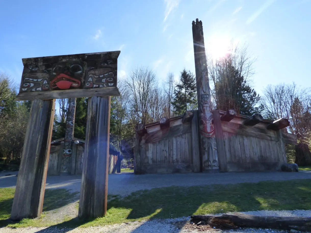 Carved wooden gateway and red painted façade