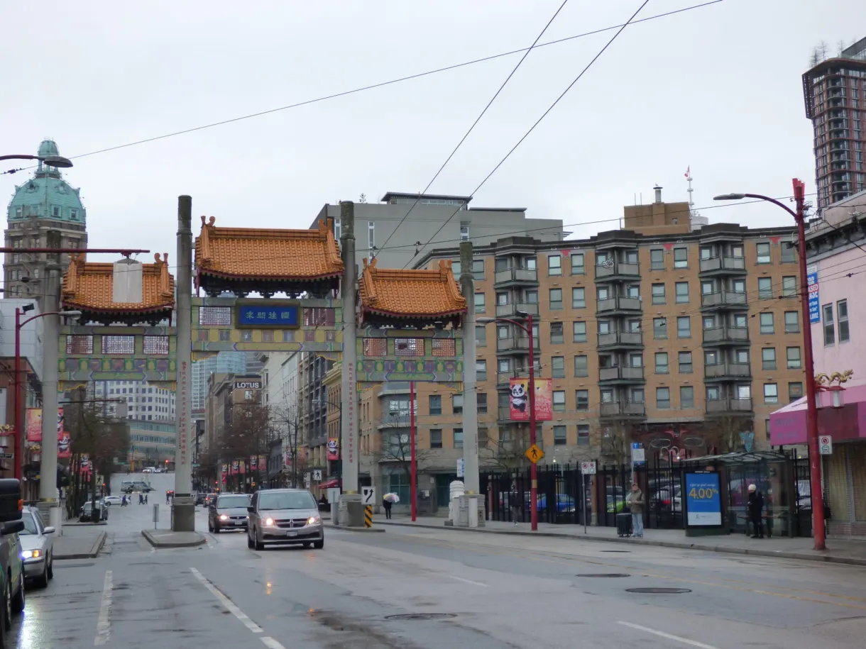 Chinese gate spanning the wet avenue