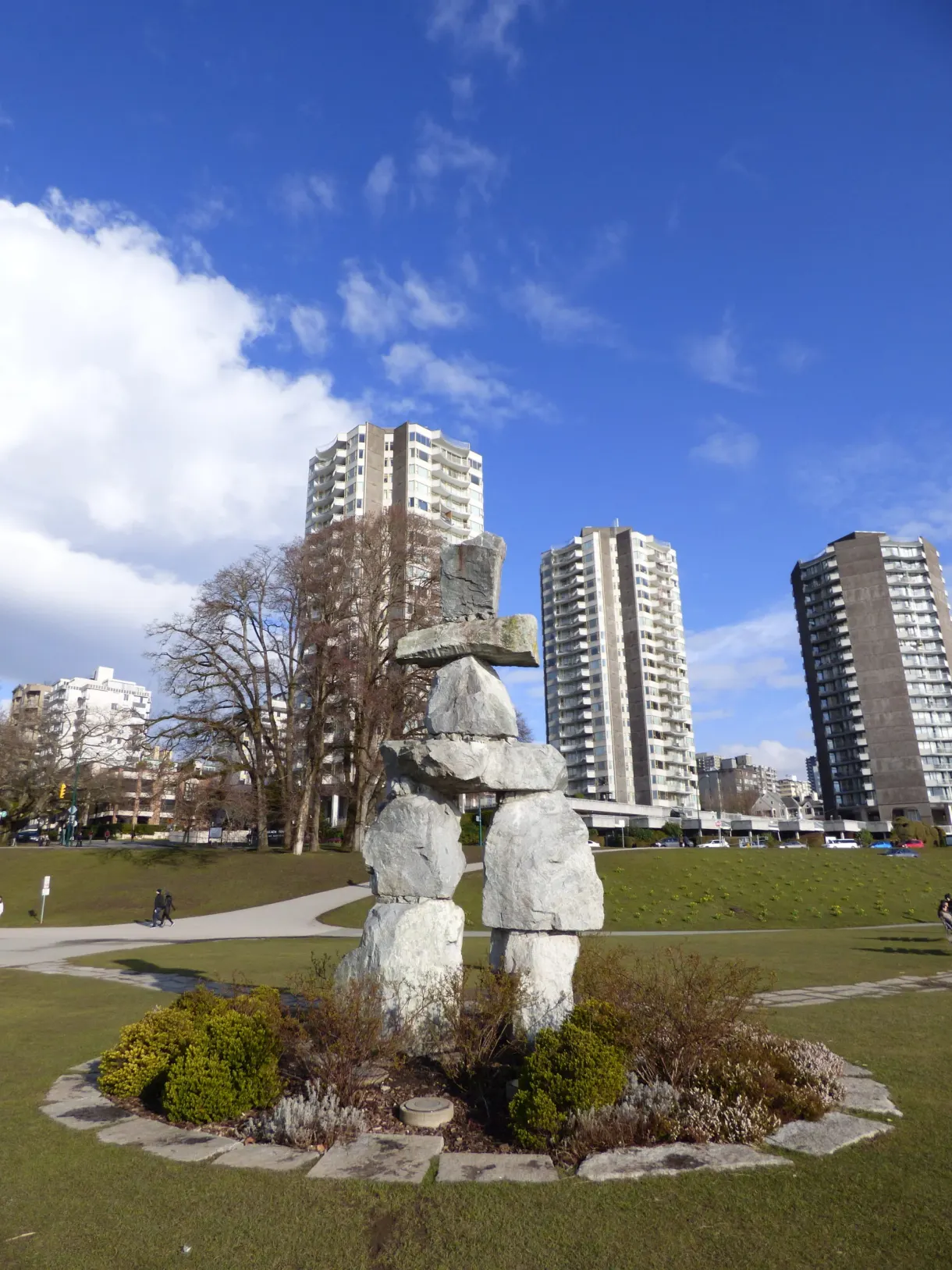 Inukshuk in the park in front of the residential towers