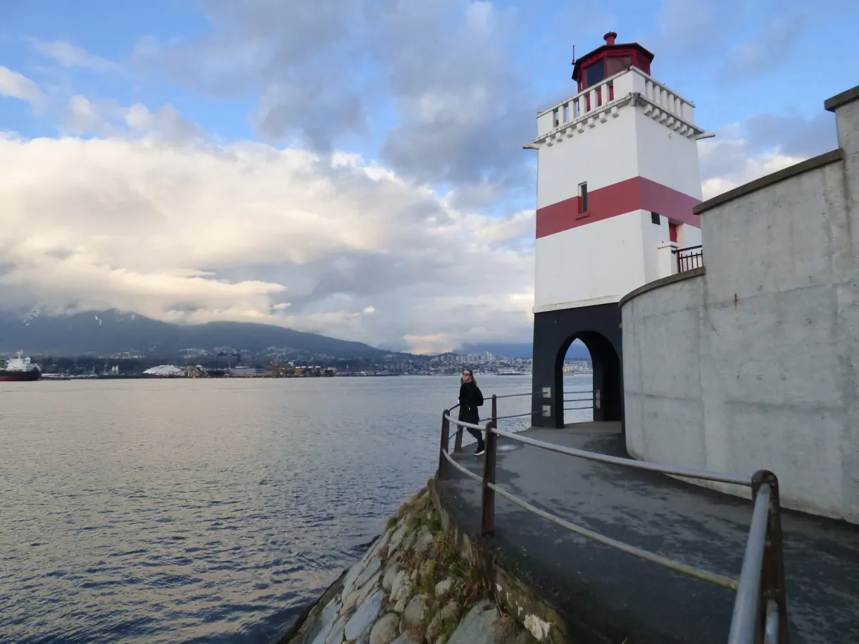 Path running along the water towards the lighthouse on the point