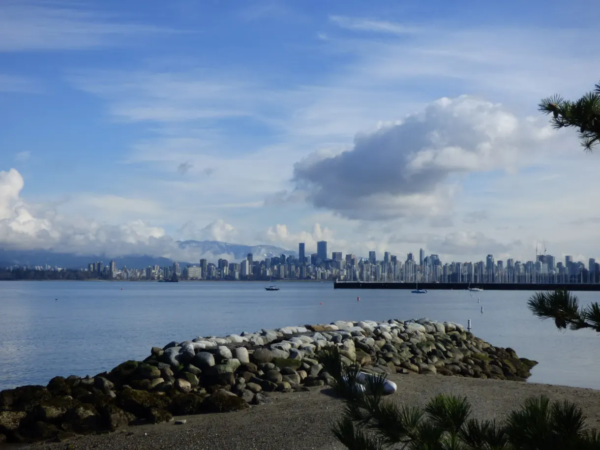 Pebble breakwater curving in front of the city