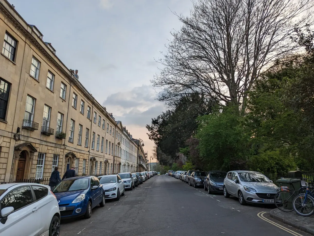 Street lined with Georgian buildings in golden stone