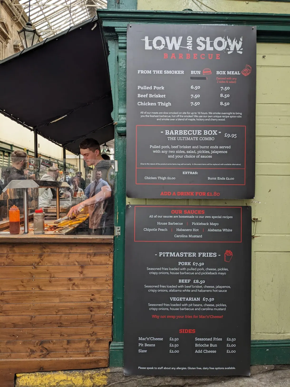 Menu board of a barbecue stall inside a market hall