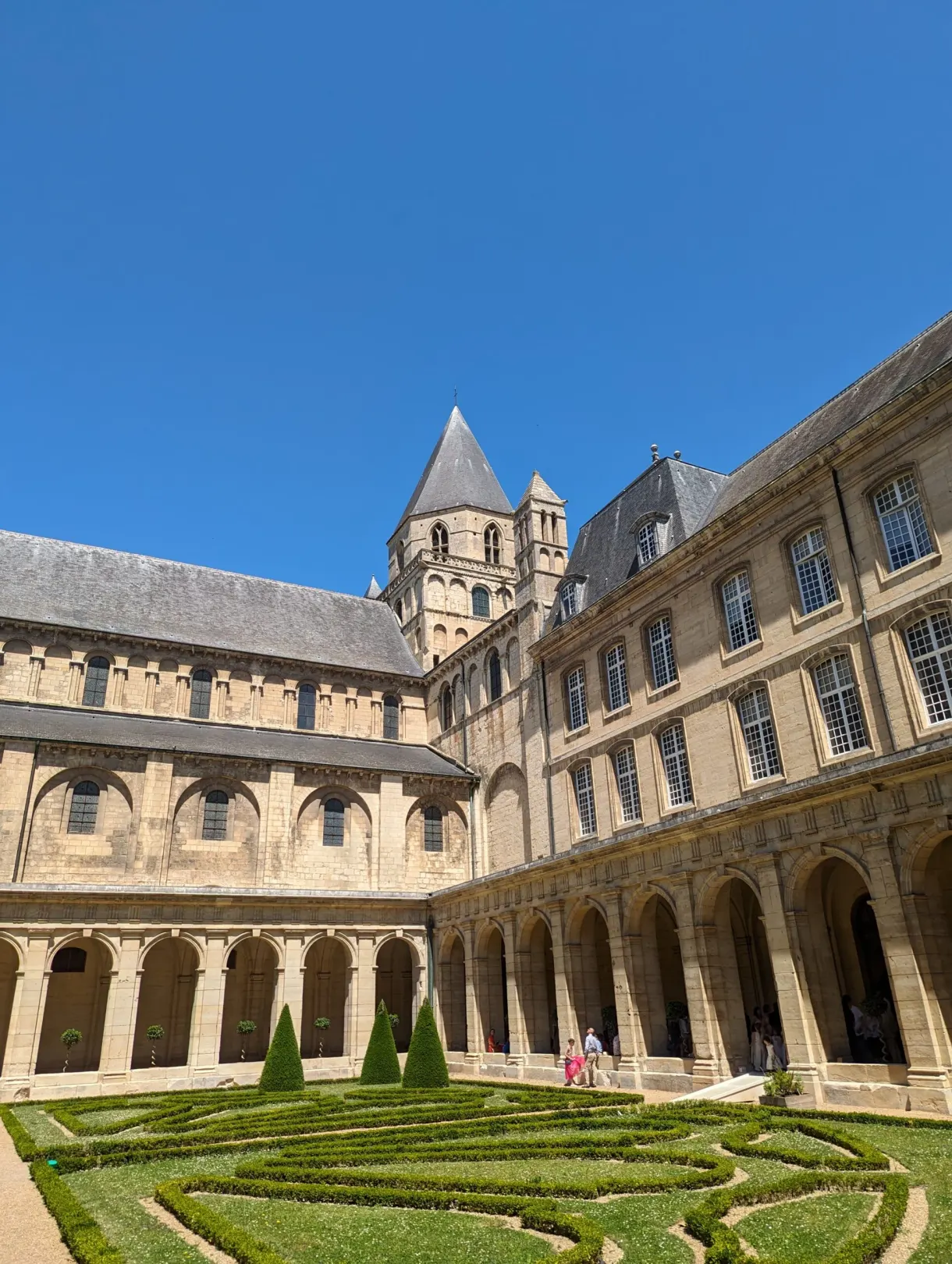 Arcaded cloister surrounding a garden of clipped box