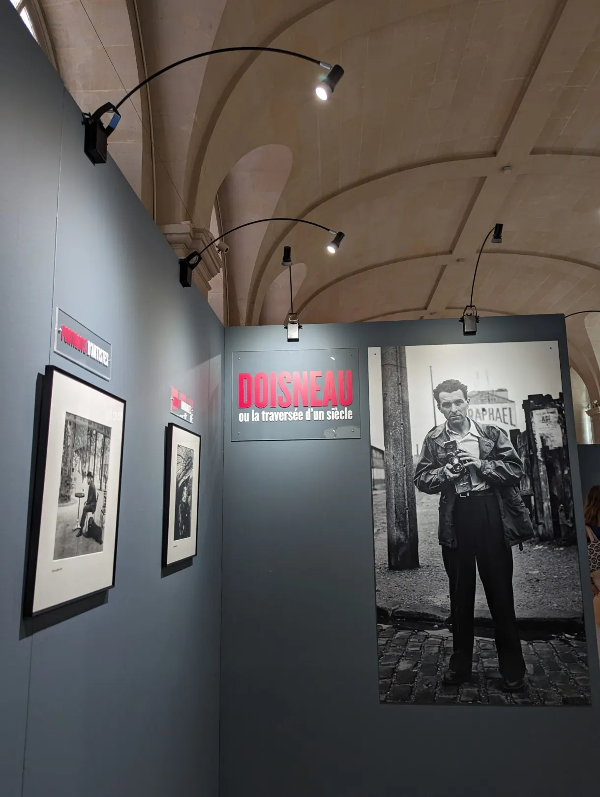 Black and white prints hung in a photography exhibition