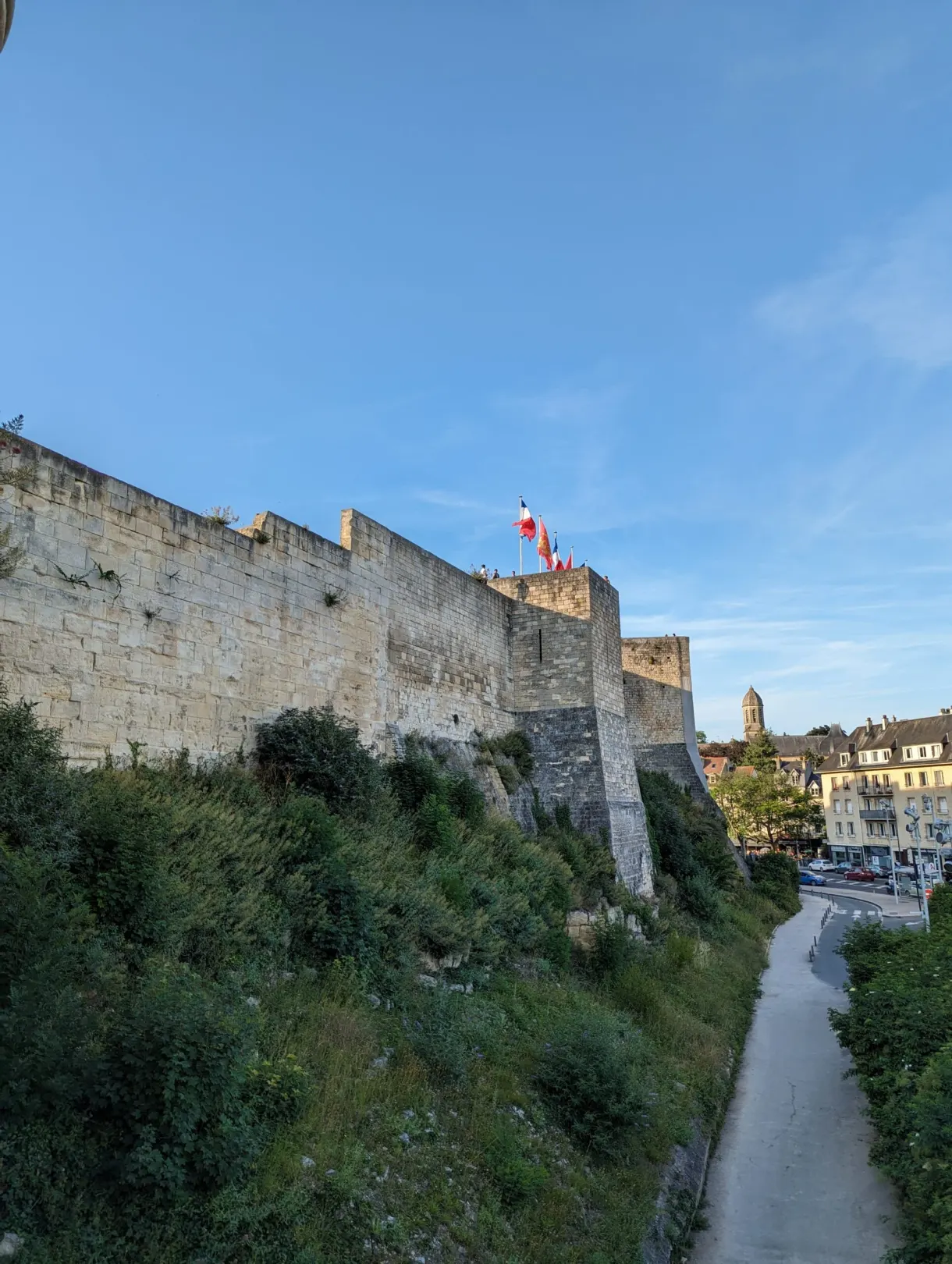Castle wall overlooking the sunken path of the ditch
