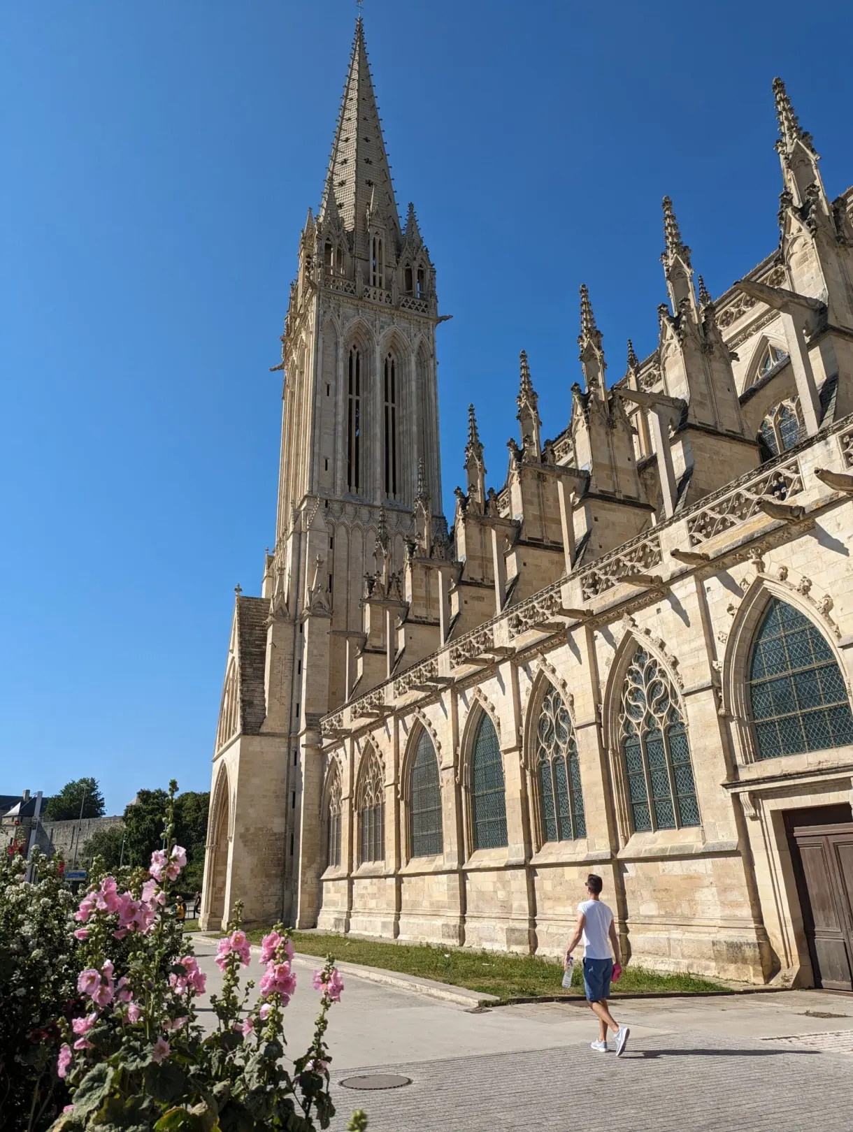 Gothic flank of the Saint-Pierre church and its stone spire