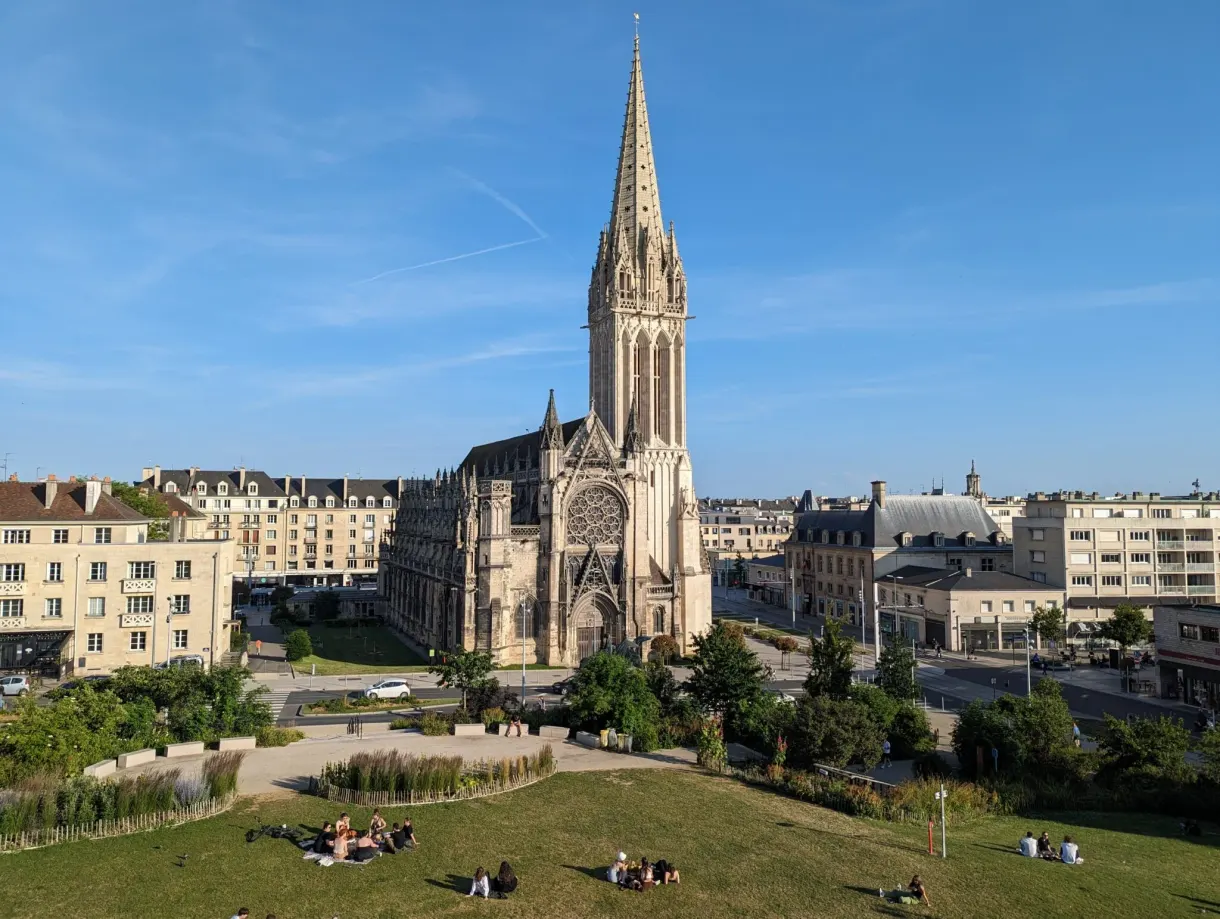 Saint-Pierre church seen from the castle mound, lawn in the foreground