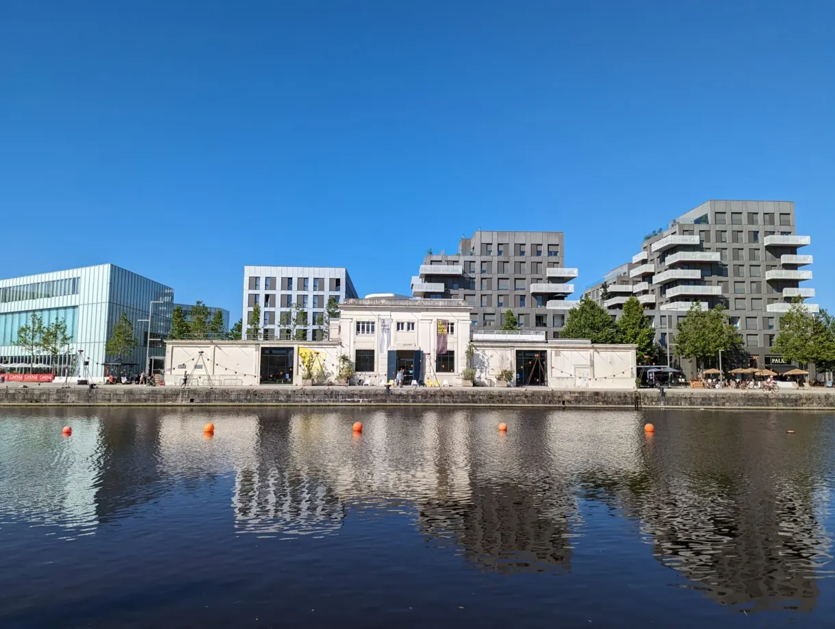 Contemporary buildings of the Presqu'île reflected in the basin