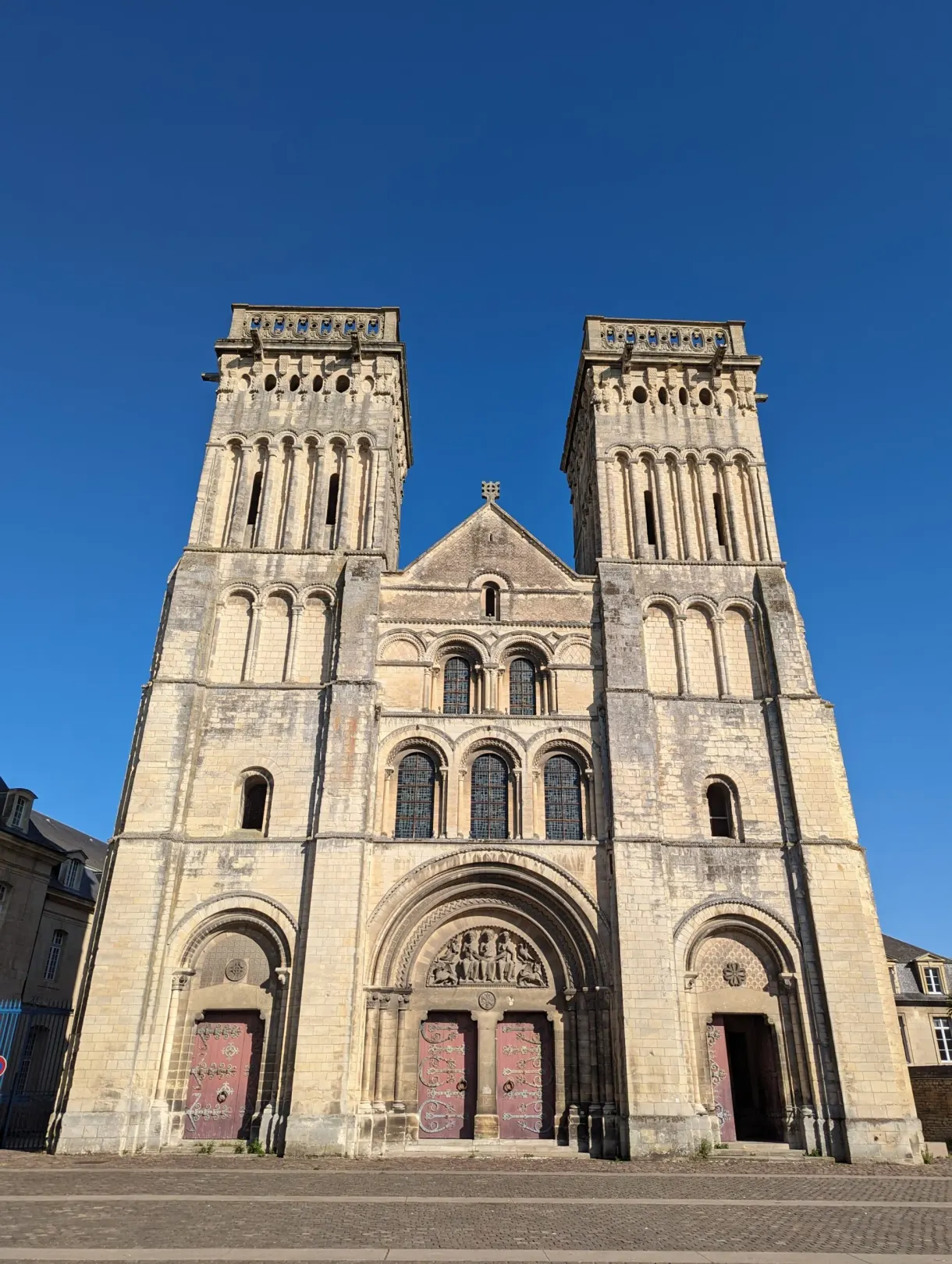 Romanesque facade with two towers of the Abbaye aux Dames