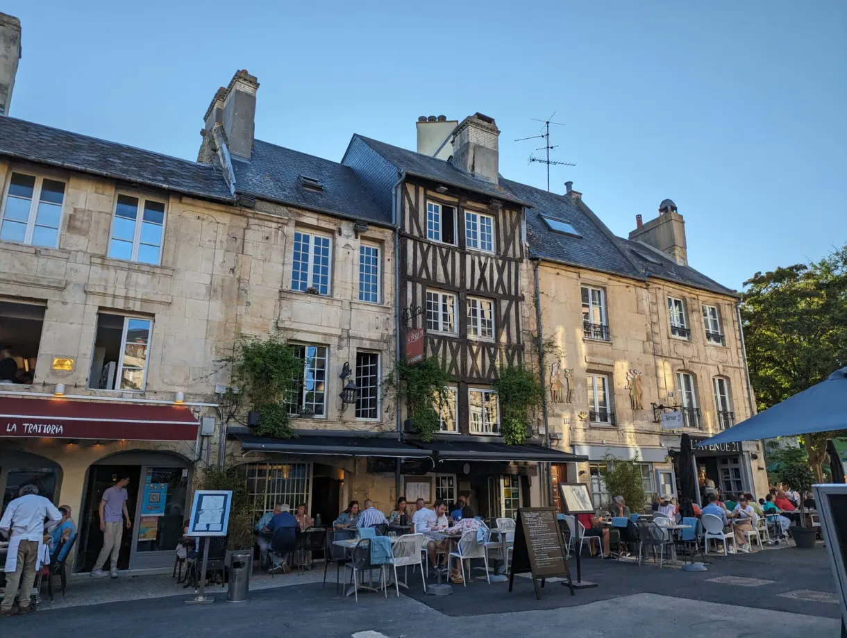 Place du Vaugueux, half timbered house and restaurant terraces