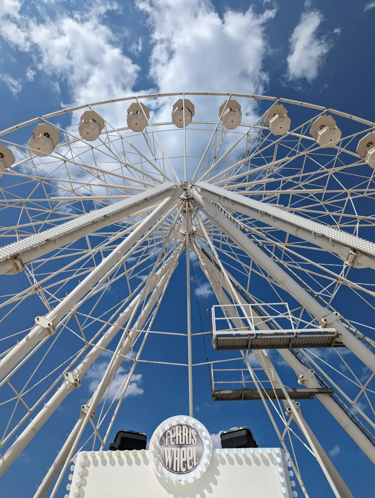 Low angle view of the cabins and spokes of the big wheel