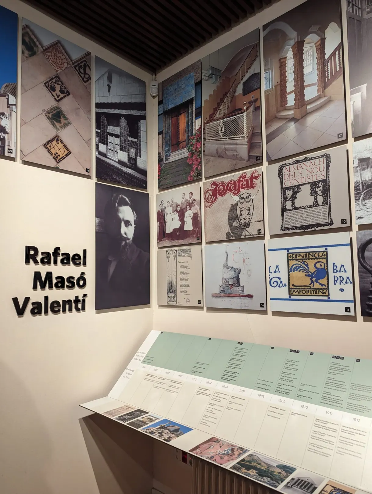 Wall of posters and Rafael Masó Valentí lettering in the Casa Masó