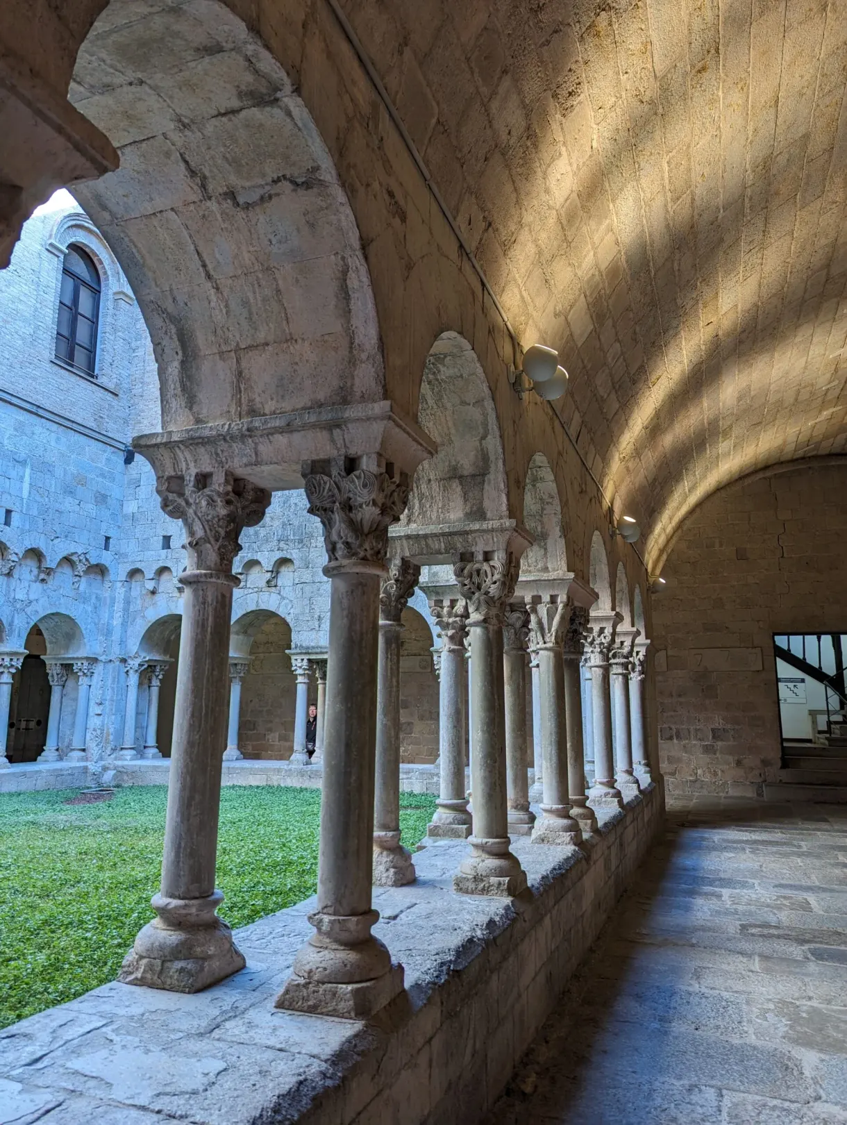 Cloister gallery with paired columns and ornate capitals