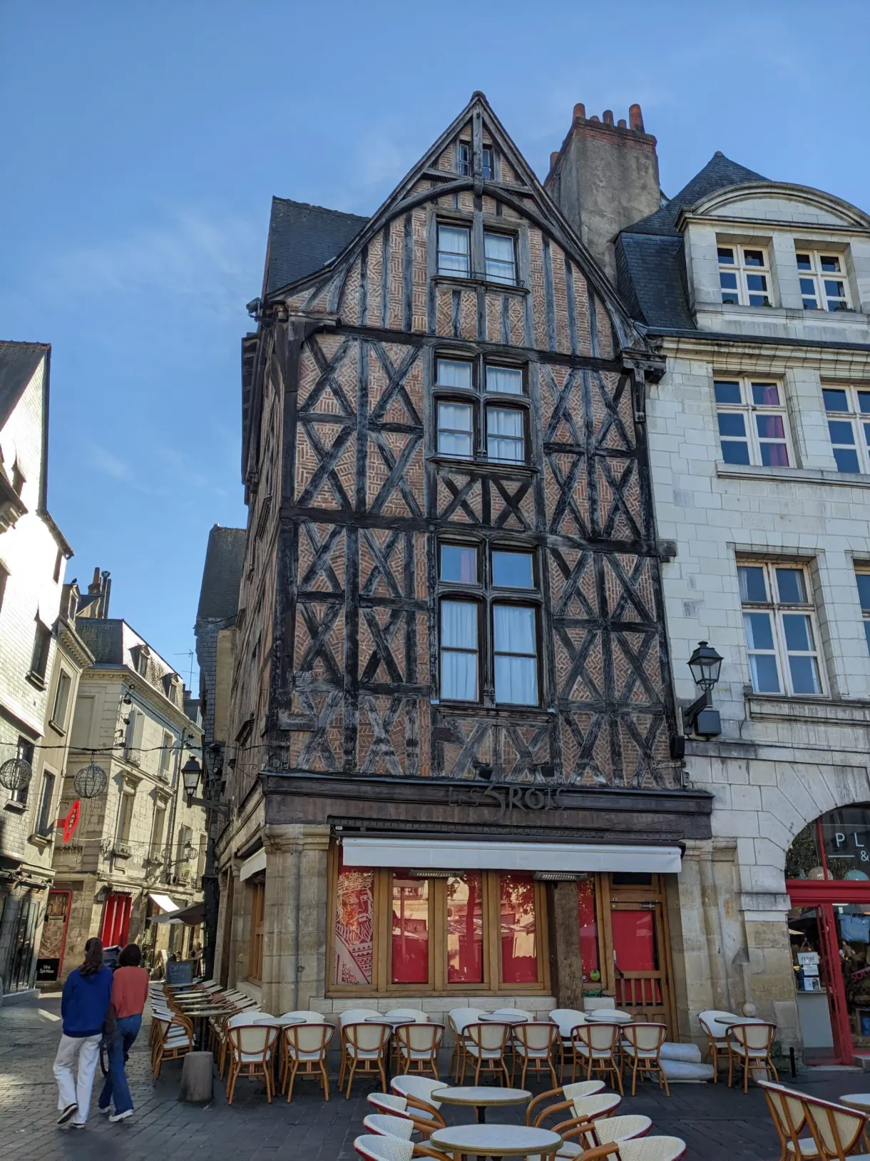 Timber-framed house above a rattan terrace