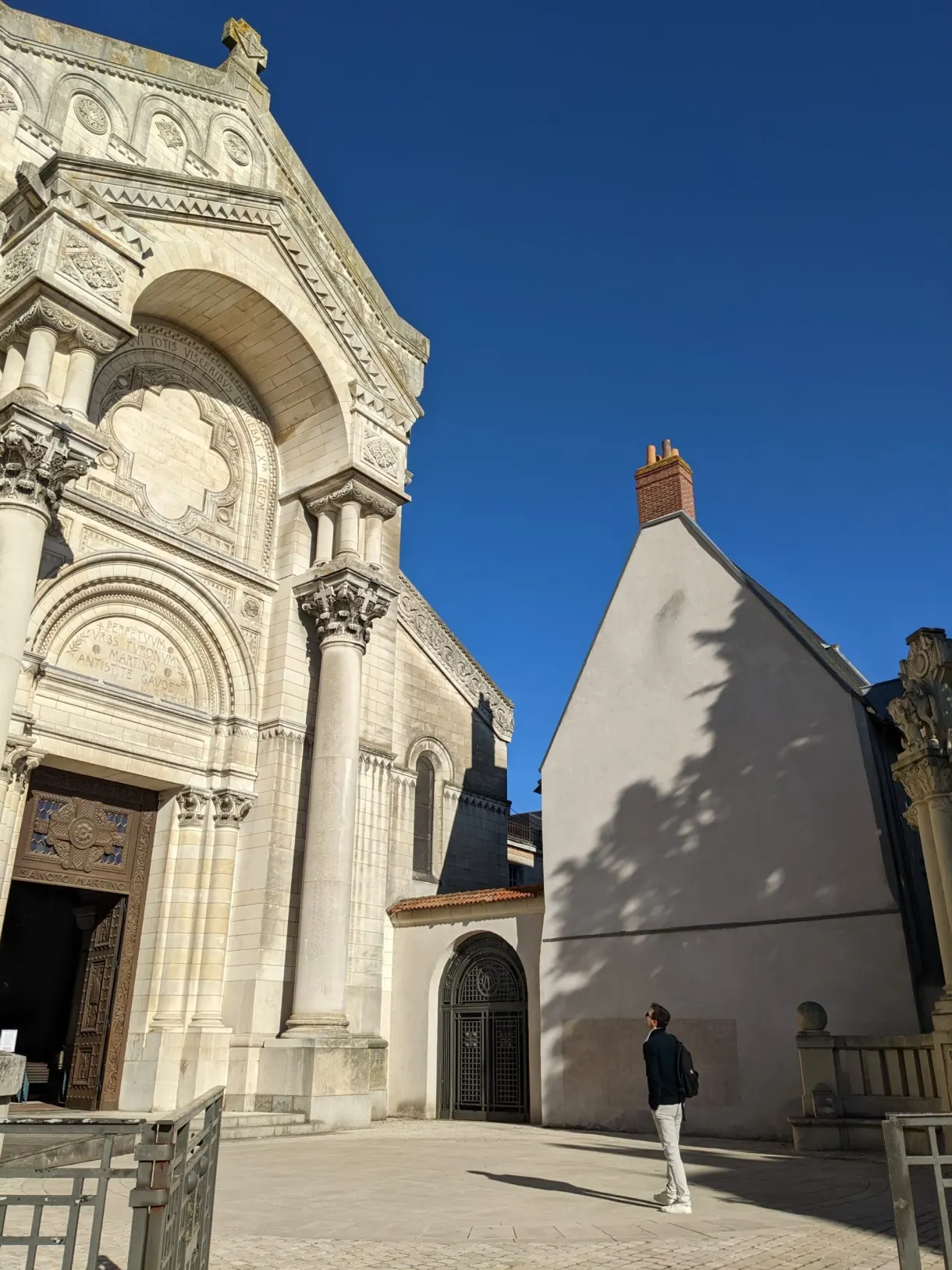 Side facade in pale stone of the Saint-Martin basilica