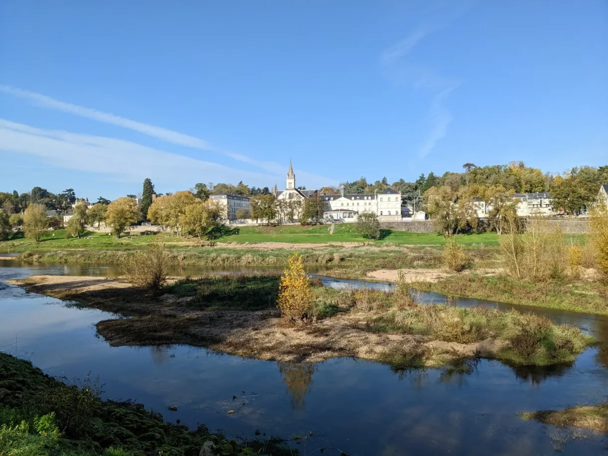 Sandbanks of the Loire and village with a bell tower on the far bank
