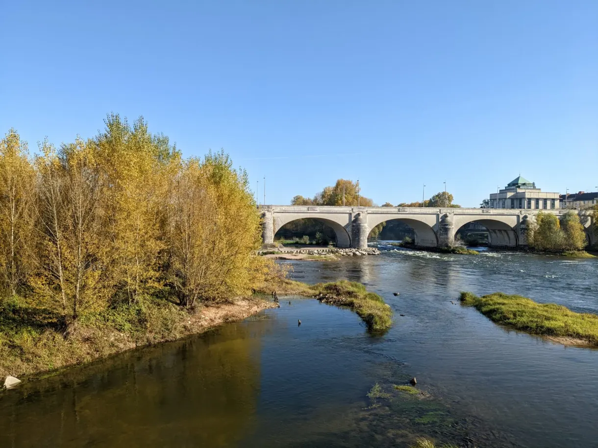 Low Loire and stone bridge glimpsed between the trees