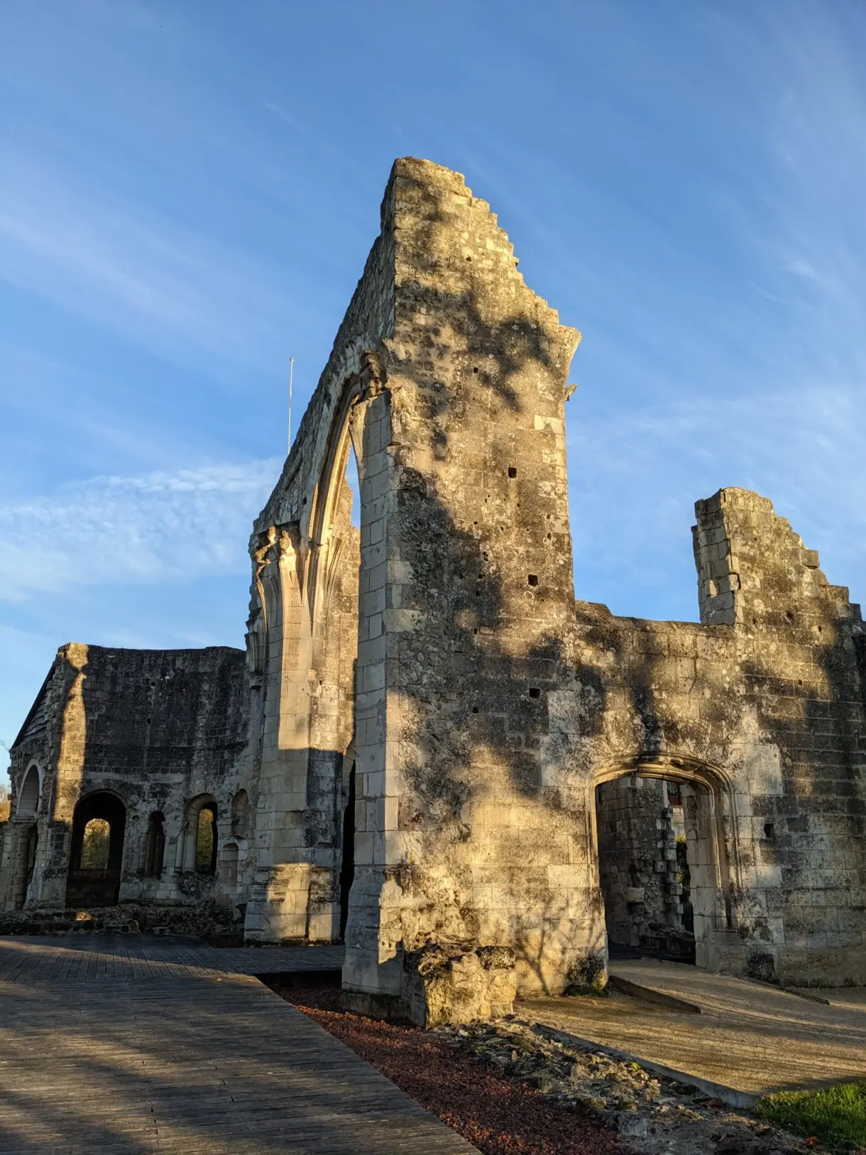 Large ruined arch gilded by the autumn sun