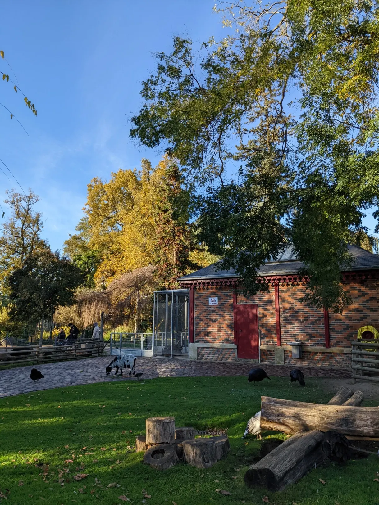 Brick pavilion and animal enclosure on the lawn