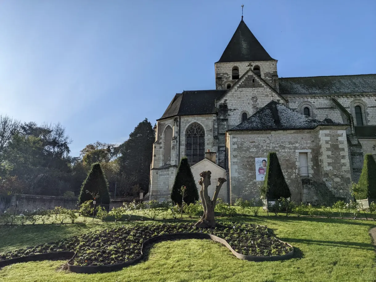 Stone church and animal-shaped topiary in the garden