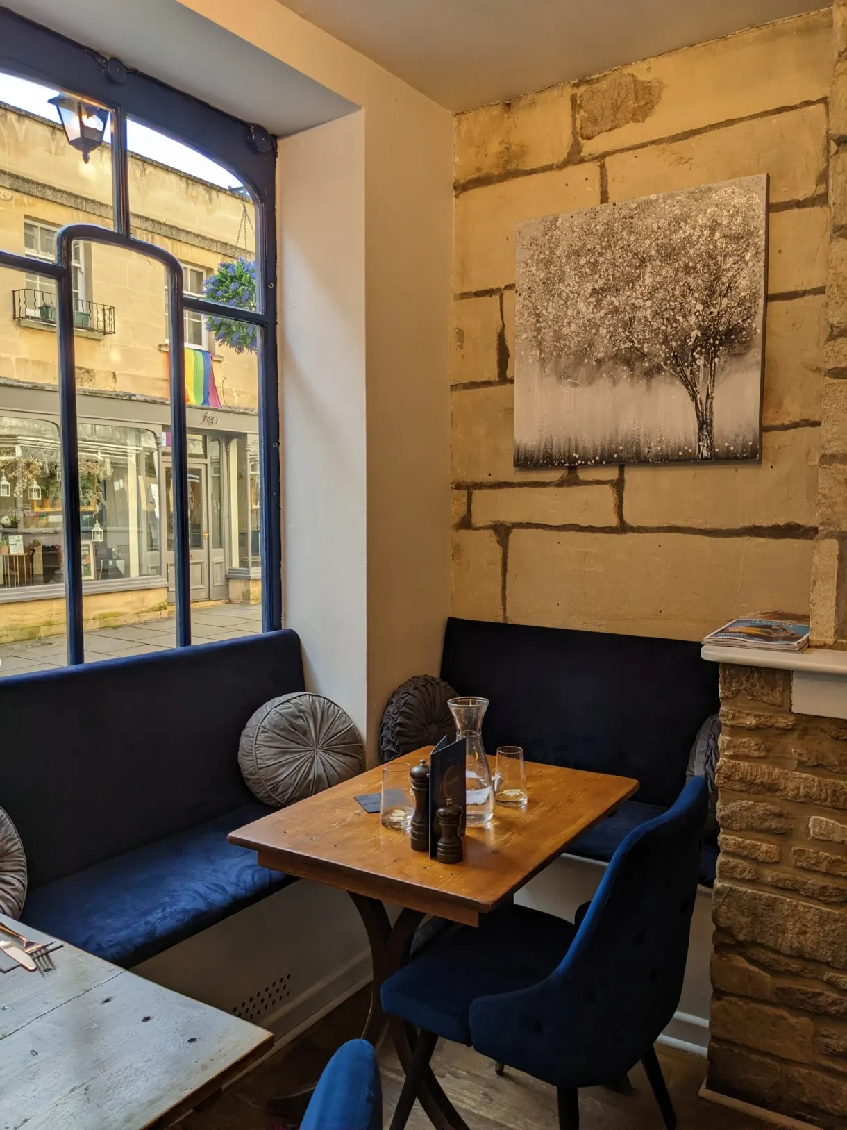Blue banquettes and stone wall of a tea room