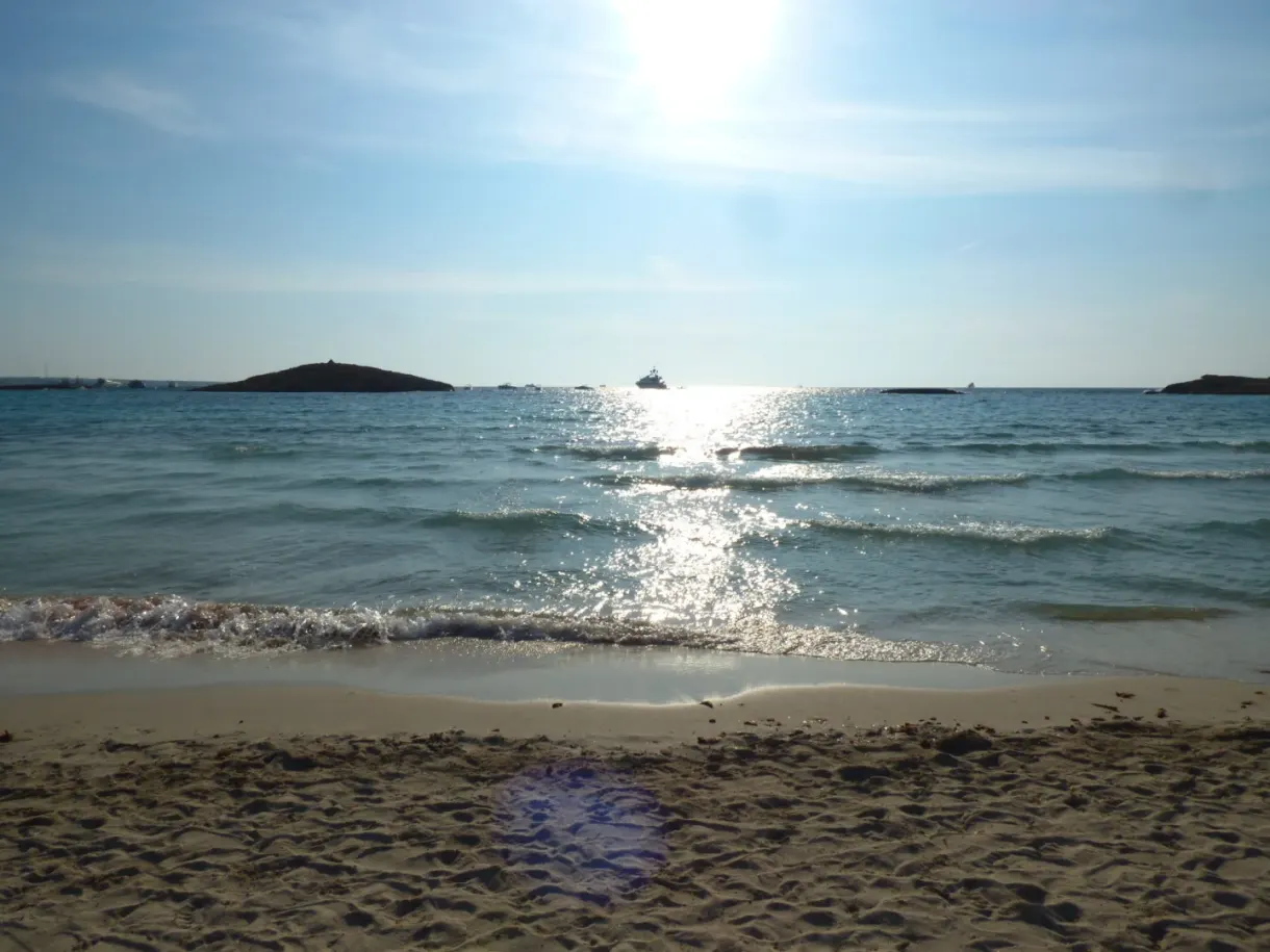 Against the light over the sea, islets on the horizon