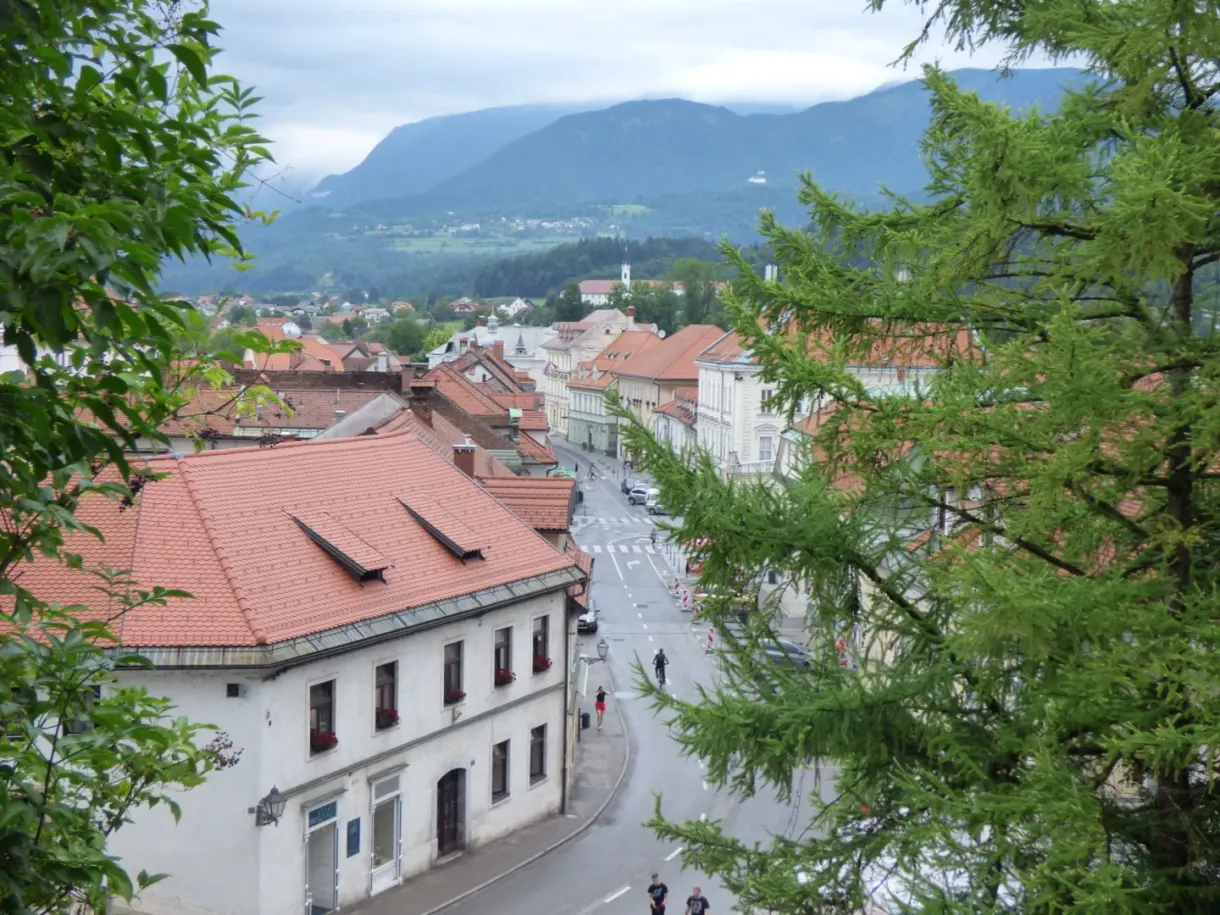 Red rooftops of the town glimpsed from a promontory